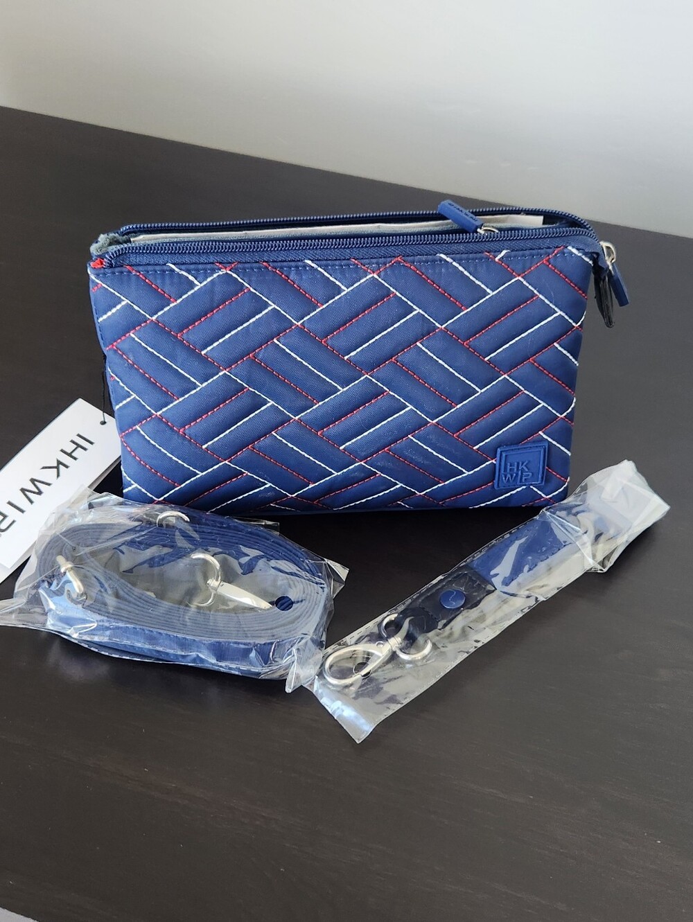 HKWR Navy Quilted Crossbody Bag with Red Accent Stitching